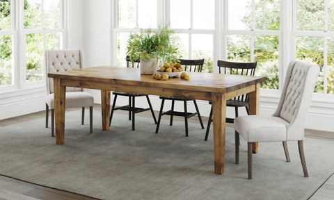 Pictured at 7’ L x 37" W in Harvest Wheat Finish. Pictured with <a href=off-white-linen-lauren-tufted-linen-chair__off.html White Lauren Tufted Linen Chairs</a> and the <a href=rustic-windsor-dining-chair__rustic.html Windsor Dining Chairs</a> in Charred Ember Finish.